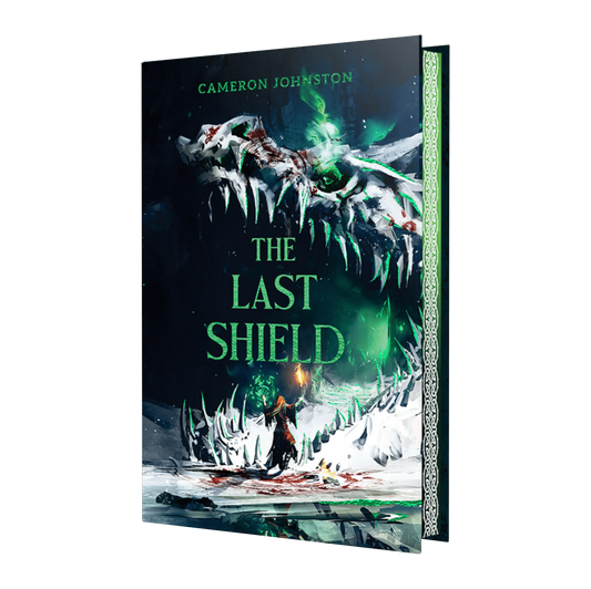 The cover of Cameron Johnston's book "The Last Shield" features a dynamic fantasy scene with a figure facing a giant, icy, skull-like structure, suggesting a thrilling adventure.