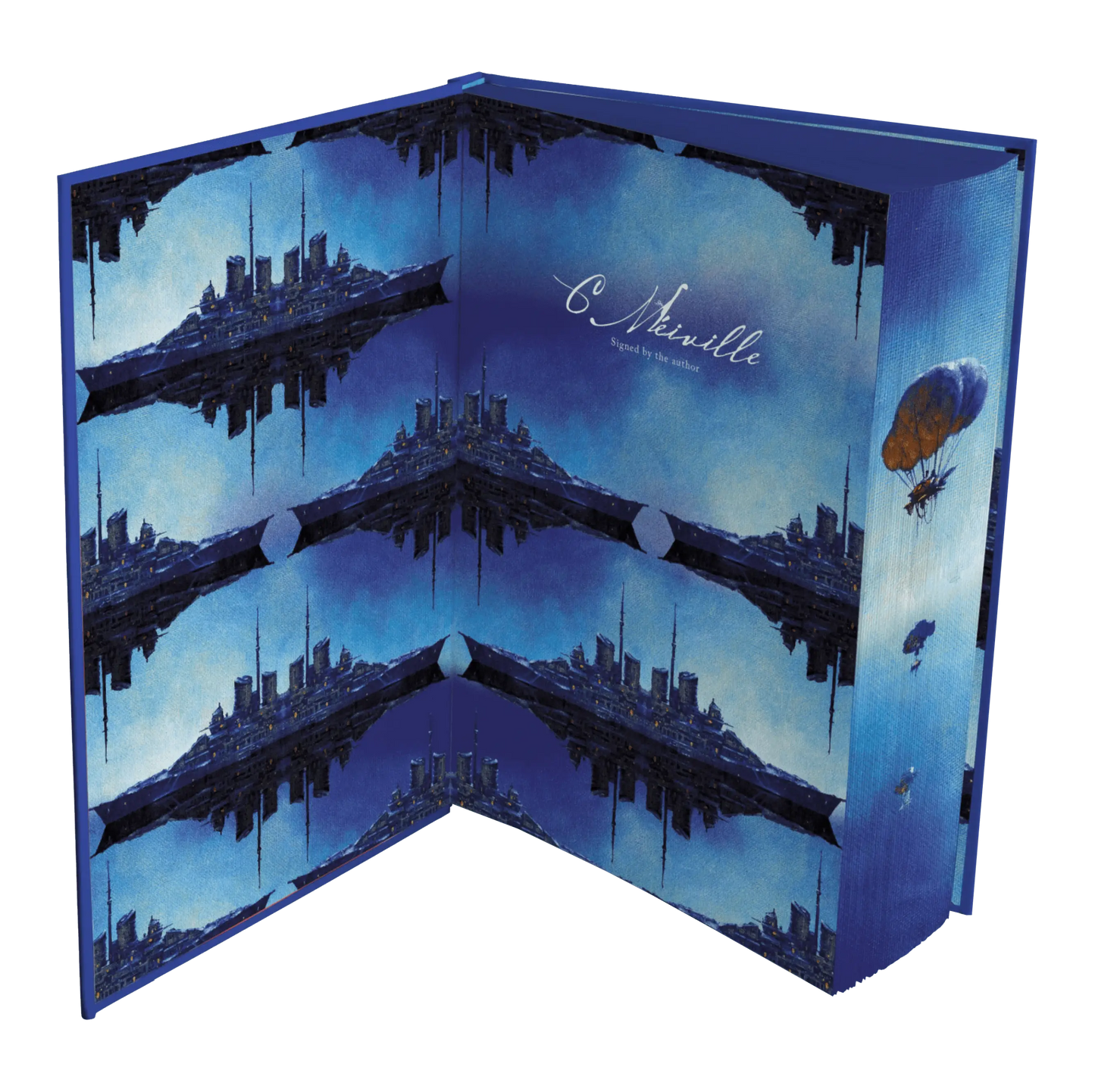 A visually striking book cover features a mirrored, futuristic cityscape against a blue sky, accompanied by a handwritten signature and a hot air balloon illustration.