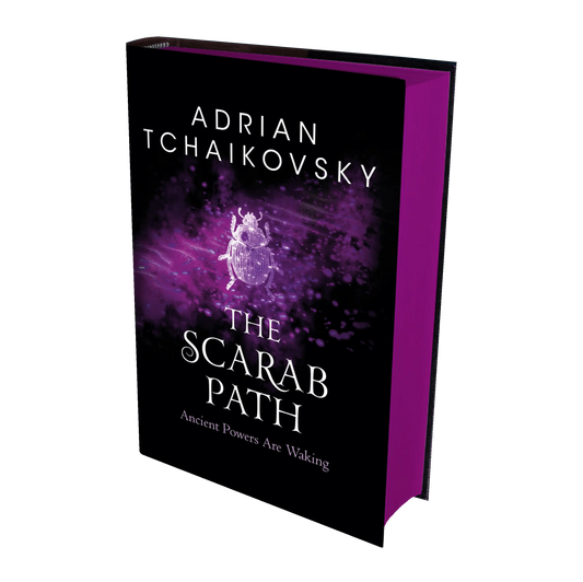Adrian Tchaikovsky's "The Scarab Path" book cover features a purple and black design with an illustrated scarab and the tagline "Ancient Powers Are Waking."