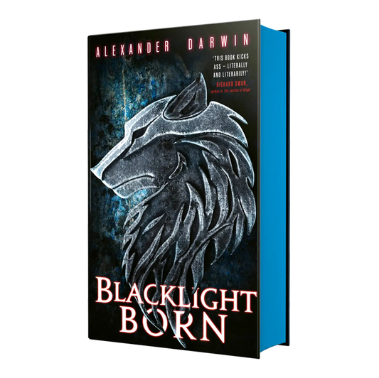 "Blacklight Born" by Alexander Darwin features a striking cover with a wolf's head in a glowing design, accompanied by a quote for an engaging fantasy novel.