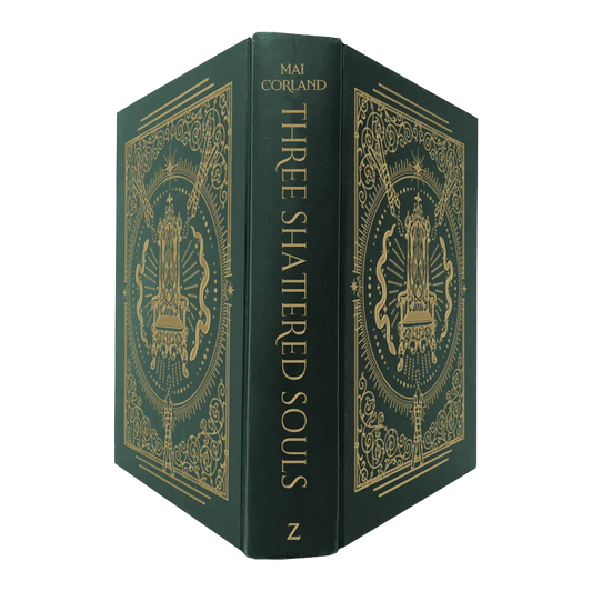 "Three Shattered Souls" by Mai Corland features an elegant dark green cover with intricate gold detailing and symmetrical patterns, reflecting a sophisticated and mysterious theme.